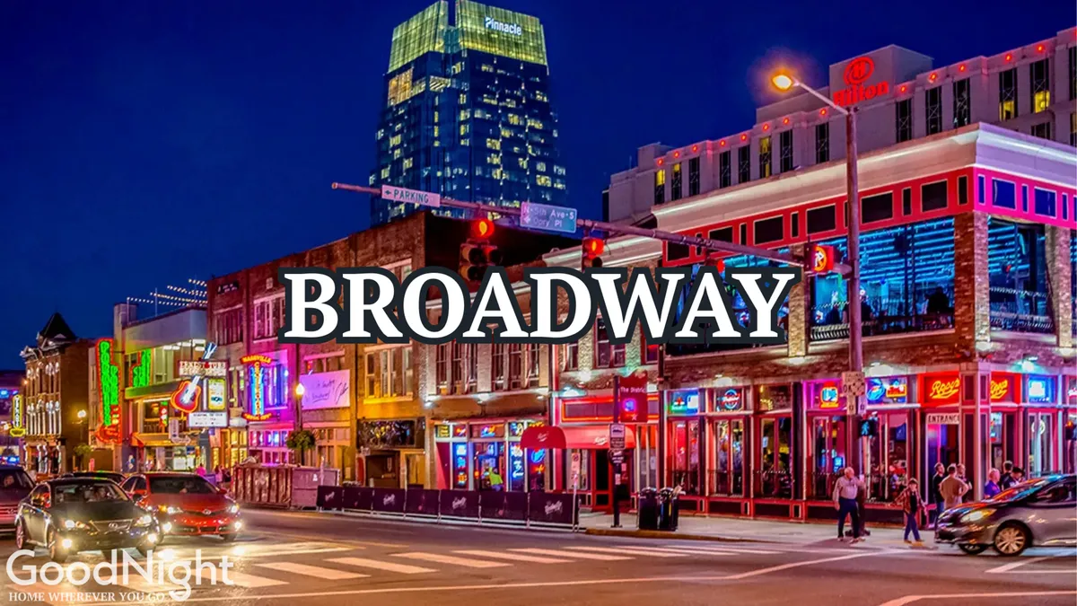 A bustling city street filled with neon signs, colorful buildings, and a lively crowd of people enjoying nightlife, dining, and live music. The energetic scene captures the essence of Midtown's vibrant urban lifestyle.