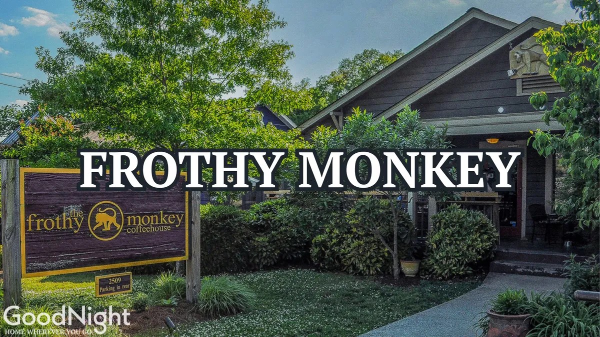 A welcoming view of Frothy Monkey’s storefront, complete with a front porch surrounded by greenery. The relaxed setting is perfect for families or groups to gather, enjoy a meal or coffee, and soak up the local atmosphere.