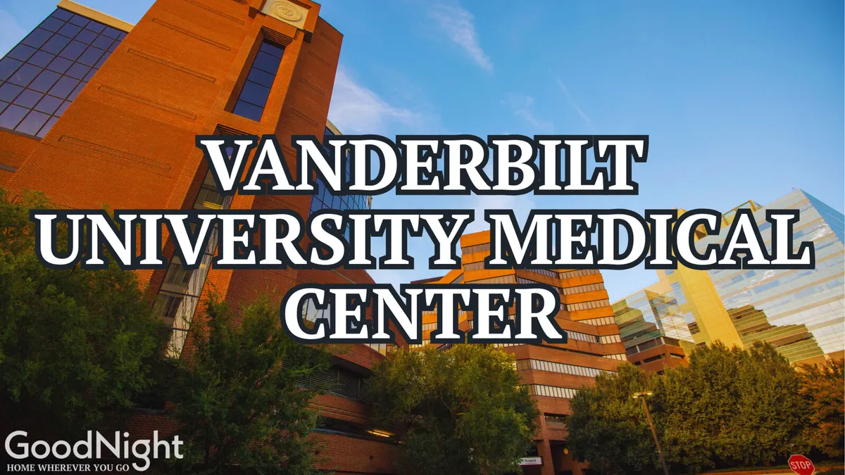 This exterior image showcases the Vanderbilt University Medical Center building surrounded by lush greenery, with the city skyline in the background. The scene evokes a sense of calm and reassurance, highlighting the facility’s modern architecture and its integration into the urban environment.